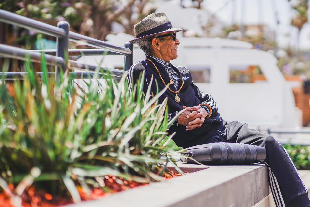 Senior enjoying an outdoor space in a supportive living environment