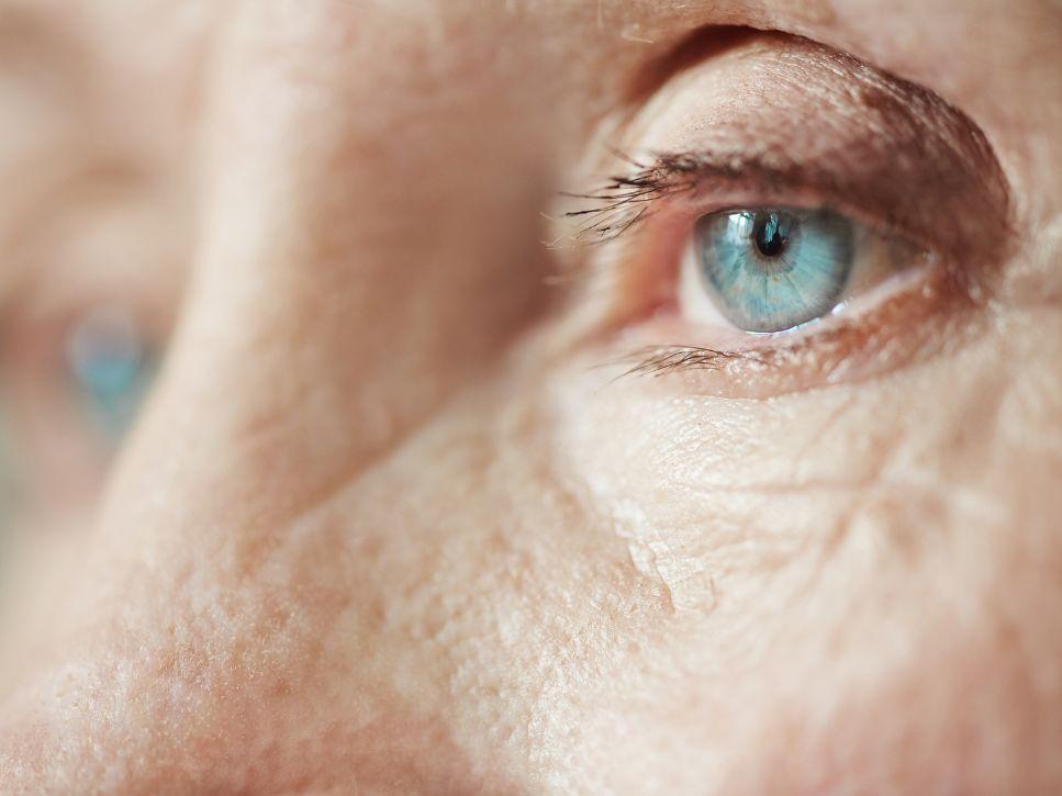 Older adult's eye reflecting on changes associated with aging